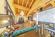 Val Thorens | Les Chalets Koh I Nor | woonkamer met tv en openhaard